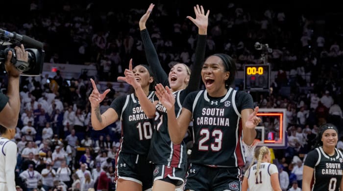 South Carolina Gamecocks center Kamilla Cardoso (10), forward Chloe Kitts (21), and guard Bree Hall (23) celebrate their victory against the LSU Tigers.